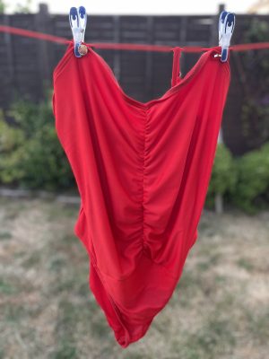 Red Swimsuit hanging on the Washing Line.